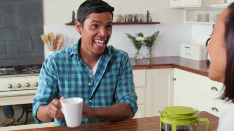 Couple talking at kitchen counter Video stock 58280880