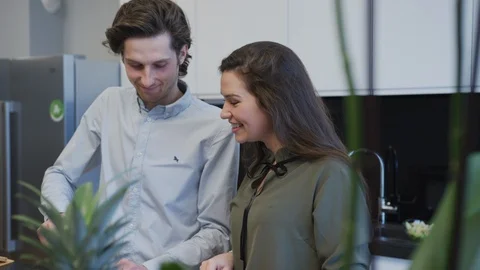 Couple talking in the kitchen Stock Footage 99941641