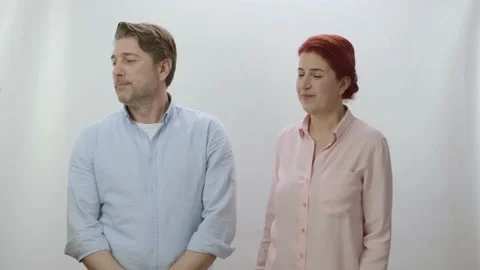 The couple is talking looking to the left of the screen. Stock Footage 198372497