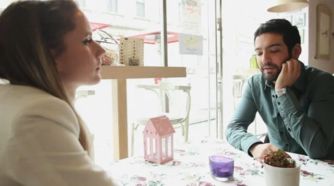 Couple talking in a restaurant Stock Footage 36457472