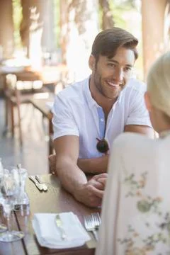 Couple talking in restaurant Stock Photos