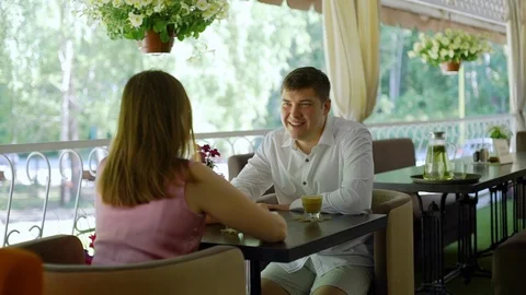 Couple Talking in a Restaurant Terrace Stock Footage 112906816