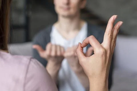 Couple talking using sign language Beautiful photo Stock Photos