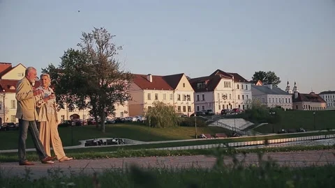 Couple talking while holding disposable coffee cup at embankment Stock Footage 168911157