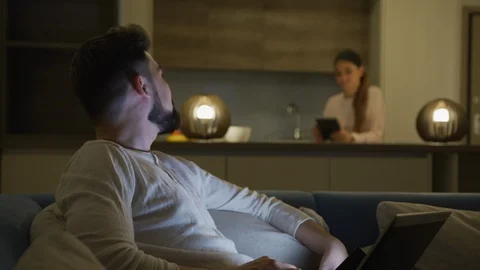 Couple talking while searching on the internet Stock Footage 100001609