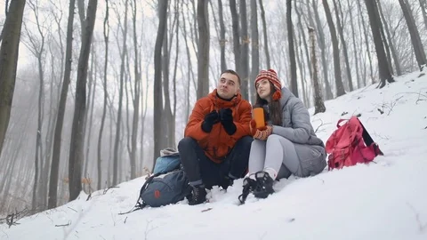 Couple Talking while Sitting in Forest Видео 103772872
