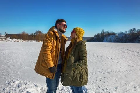 A couple talking in a winter day. Stock Photos