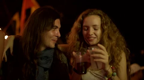 Couple talks and drinks at a party Stock Footage 63082185