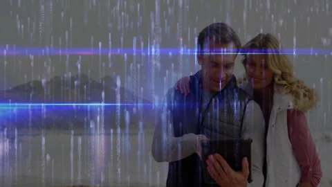 Couple tapping tablet screen and pointing at display while digital glitch Stock Footage 312041357