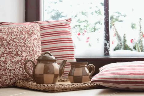 Couple of tea cups on the window, view to the winter garden Stock Photos