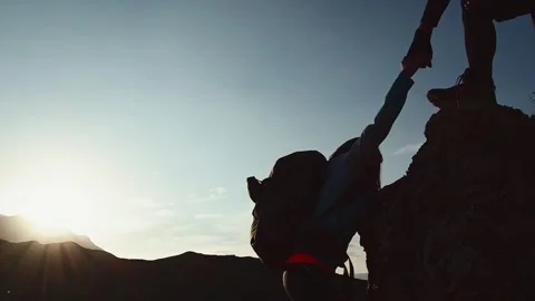Couple teamwork together help on challenge travel. Helping hand silhouette .. Stock Footage 283726399