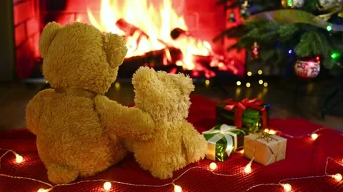 Couple of teddy bears sit hugging each other on a knitted blanket against the Stock-Footage 220131114