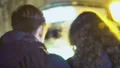 Couple of teenagers slowly walking around evening city, back view, promenade HD Footage