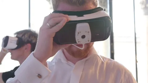 A Couple Testing Virtual Augmented Reality Goggles In A Museum Stock Footage 73217157