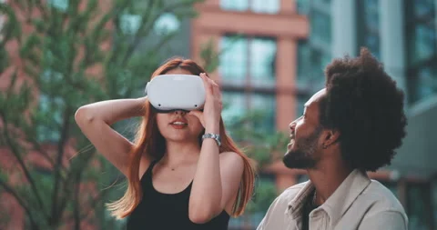 A couple testing vr glasses in the business district Stock Footage 201673636