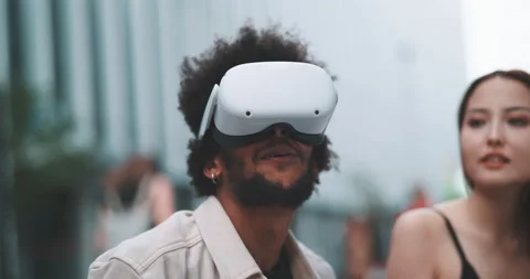 A couple testing vr goggles in the city centre Stock Footage 201674845
