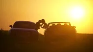 Couple In Their Cars Kissing During Sunset Stock Footage