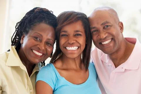 Couple With Their Teenage Daughter Stock Photos