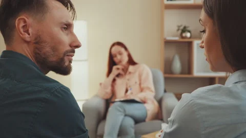 Couple in Therapy Session with Therapist in Background Stock Footage 330301643