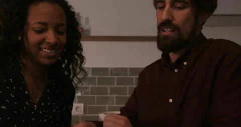 Couple thinking over plans in kitchen 動画素材 194420066