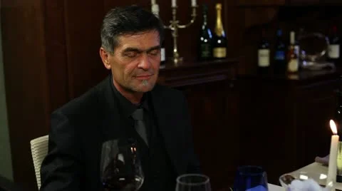 Couple toasting with wine before dinner Stock Footage 27825573