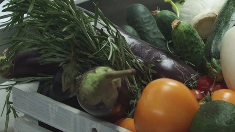 Couple of tomatoes falling at a heap of vegetables 스톡 동영상 80801745
