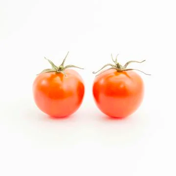 Couple tomatoes with green leaf Stock Photos