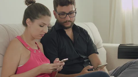 Couple touching the tablet to watch shows and movies on the Internet Video stock 59327968