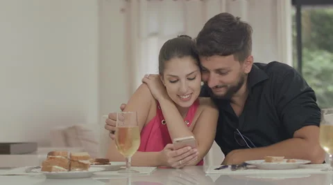 Couple touching the tablet to watch shows and movies on the Internet Video stock 59329246