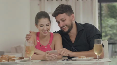 Couple touching the tablet to watch shows and movies on the Internet Video stock 59329313
