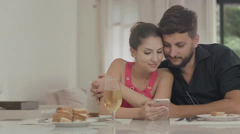 Couple touching the tablet to watch shows and movies on the Internet Video stock 59329385