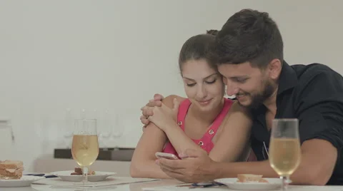 Couple touching the tablet to watch shows and movies on the Internet Video stock 59329468