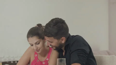 Couple touching the tablet to watch shows and movies on the Internet Video stock 59329542