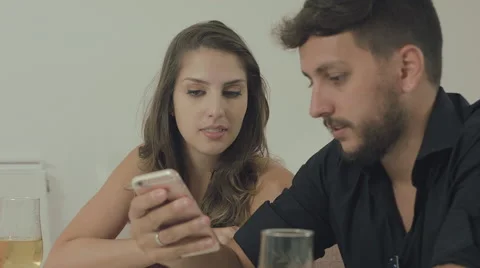 Couple touching the tablet to watch shows and movies on the Internet Video stock 59329747