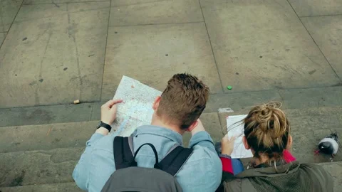 Couple tourists looking at Map 4k Video stock 151479545