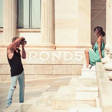 A couple of tourists visiting the Ancient Museum with man photographer and sexy Stock Photos