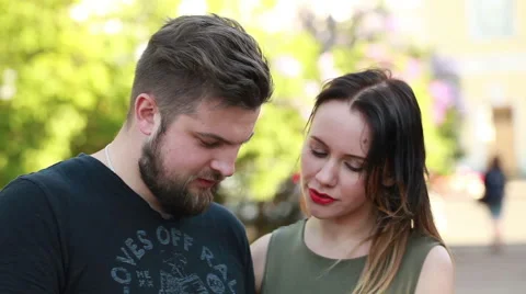 Couple in town connected on digital tablet Stock Footage 50980984