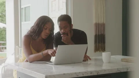 A Couple Tries to Figure Out a Problem on the Computer  From Home Stock Footage 208791964