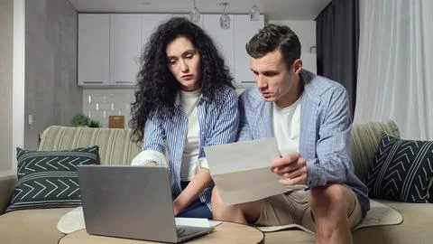 Couple tries to solve problems with expensive utility bills 写真素材