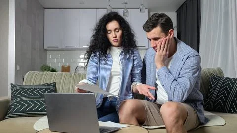 Couple tries to solve problems with expensive utility bills 写真素材