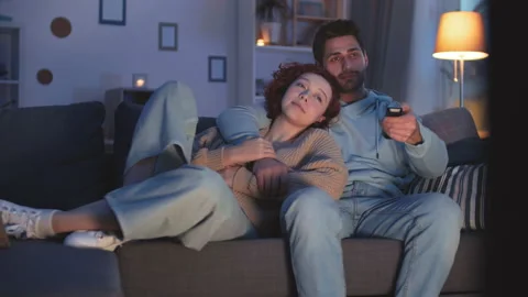 Couple Turning on TV in Evening Vídeo Stock 145828404