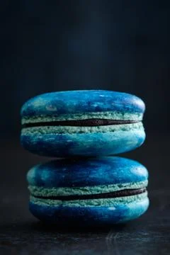 A couple of Ultra Violet macaroons and macarons with space pattern, macro. Fotos Stock
