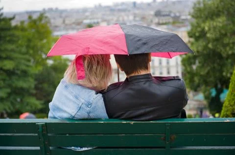 Couple with umbrella Stock Photos