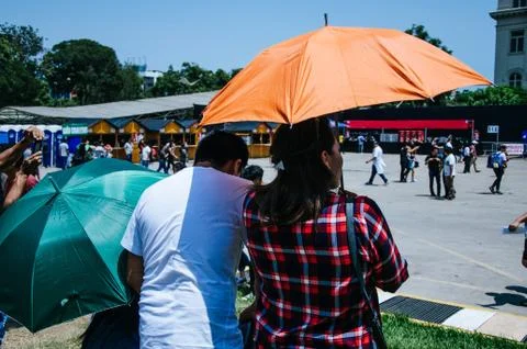 A couple with umbrella Stock Photos
