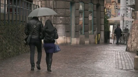 Couple under umbrella Stock Footage 73605089