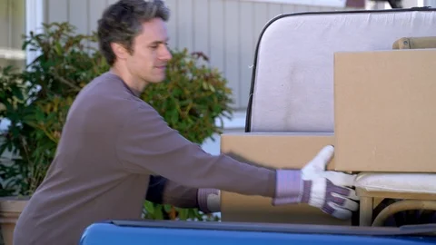 Couple unloading van and carrying boxes to house. Stock-Footage 88162191