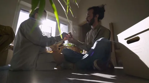 Couple unpacking boxes in new flat Stock Footage 145313392