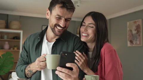 Couple use mobile phone for text message or browse internet at home Stock Footage 279780231