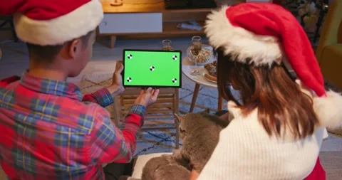 Couple use tablet during Xmas Stock Footage 139376724