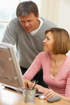 Couple Using Computer Stockfoto's